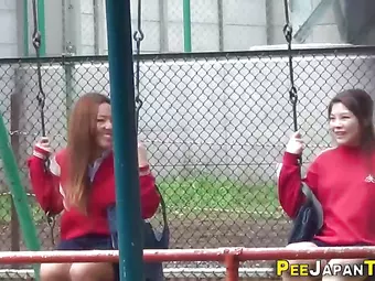 Sporty asian babes peeing outdoors